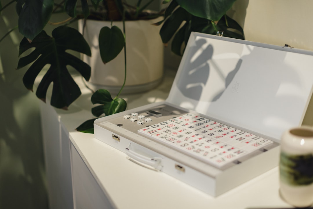 A laptop computer sitting on top of a white table