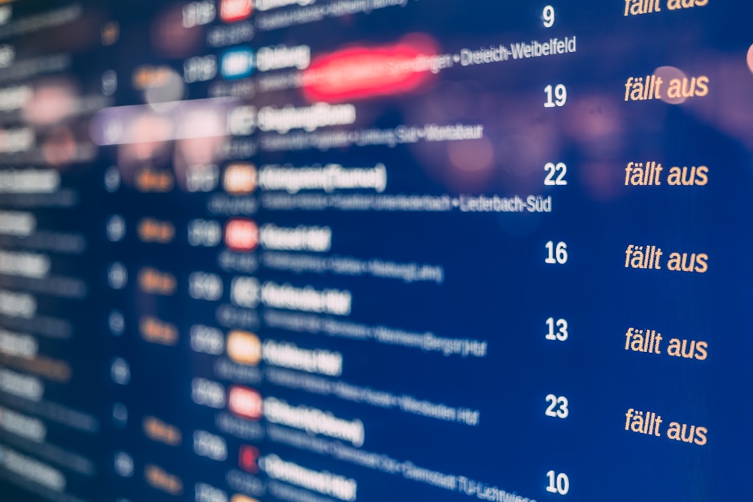 Digital display board showing train departures and cancellations
